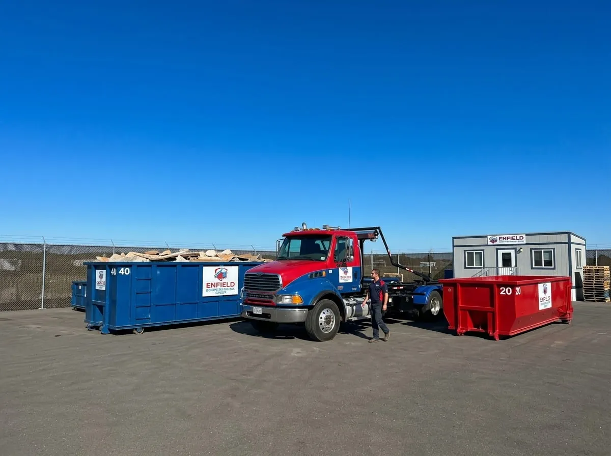 Enfield Dumpster Rental Group roll-off truck fleet parked at the Enfield yard Enfield Dumpster Rental Group roll-off truck fleet parked at the Enfield yard